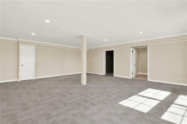 basement featuring carpet flooring and crown molding