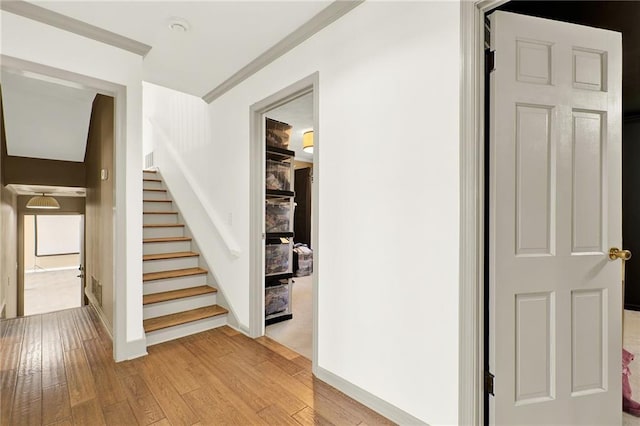 interior space featuring ornamental molding and hardwood / wood-style flooring