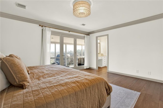 bedroom featuring ensuite bath, french doors, access to exterior, ornamental molding, and hardwood / wood-style flooring