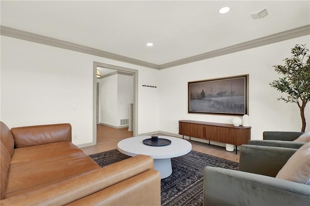 living room featuring ornamental molding and hardwood / wood-style floors