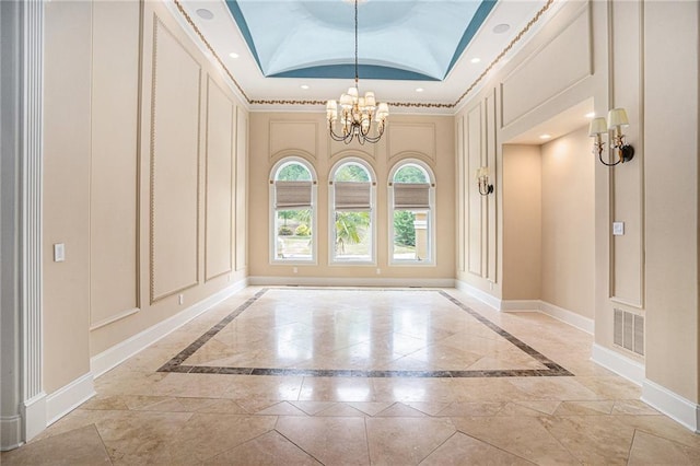 interior space with an inviting chandelier and lofted ceiling