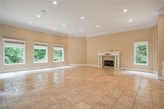 unfurnished living room with ornamental molding and a fireplace