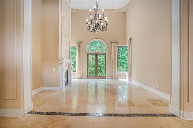 entrance foyer featuring a high ceiling and a chandelier