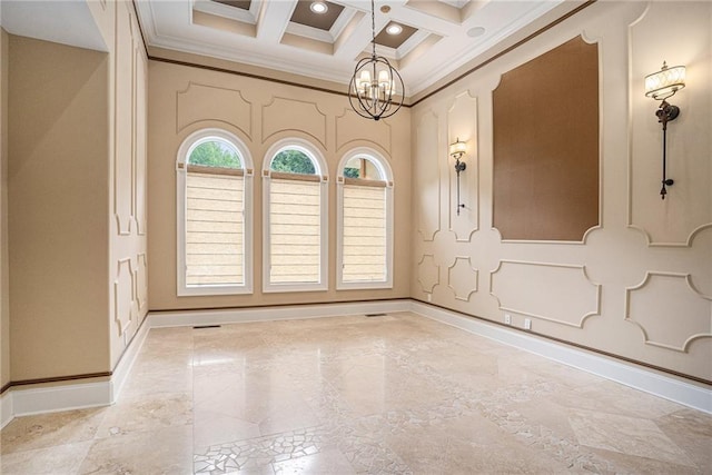 spare room with coffered ceiling, a chandelier, ornamental molding, and beam ceiling