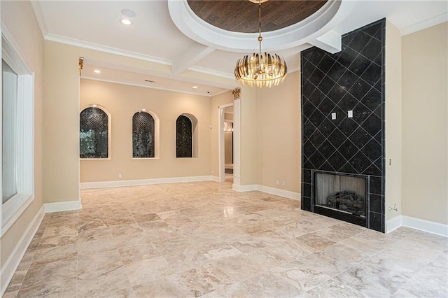 empty room with coffered ceiling, a fireplace, a chandelier, and crown molding
