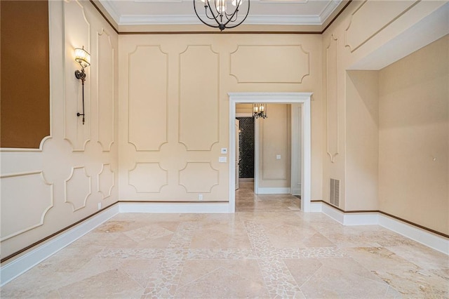empty room with an inviting chandelier and crown molding