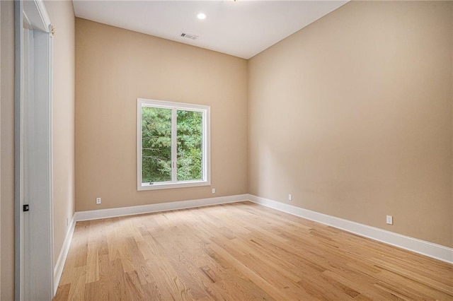 spare room with light wood-type flooring
