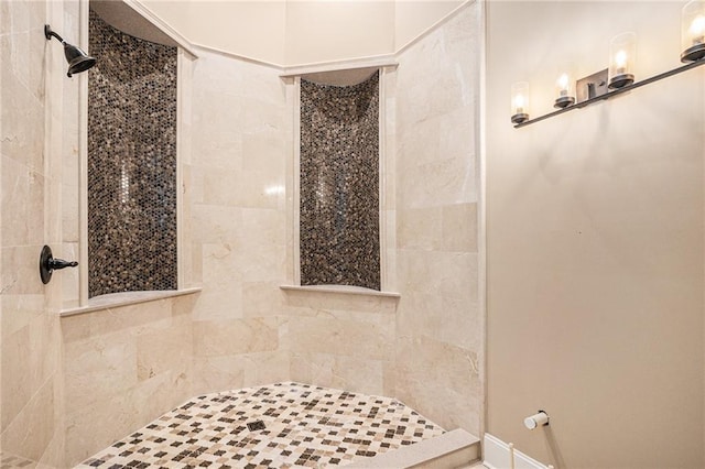 bathroom featuring tiled shower