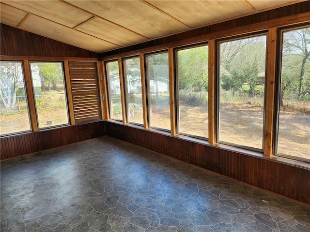 unfurnished sunroom featuring wood ceiling and vaulted ceiling