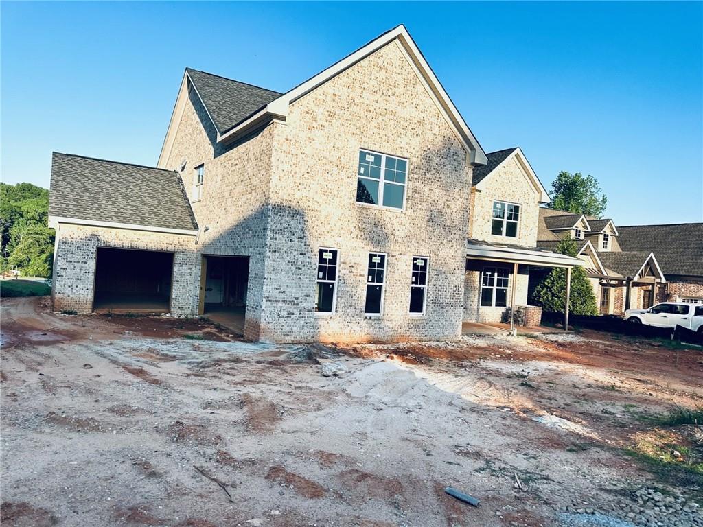 5643 Meadow View Dr, Jefferson, GA 30549 - view of front facade featuring an attached garage and brick siding