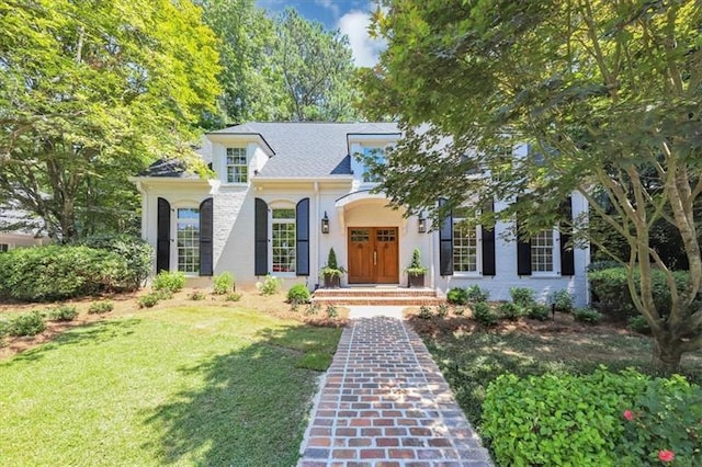 mediterranean / spanish-style house featuring a front yard