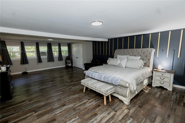 bedroom with dark hardwood / wood-style flooring