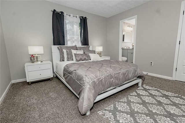 carpeted bedroom with ensuite bathroom