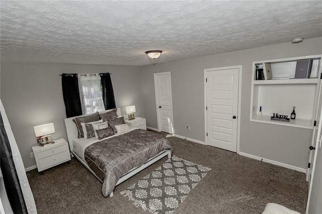 carpeted bedroom featuring a textured ceiling