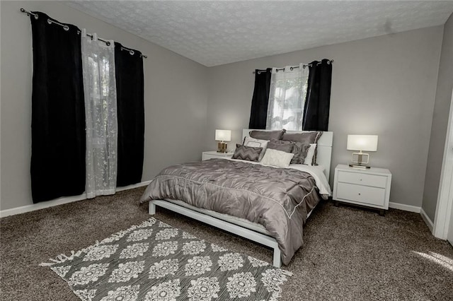 carpeted bedroom with a textured ceiling