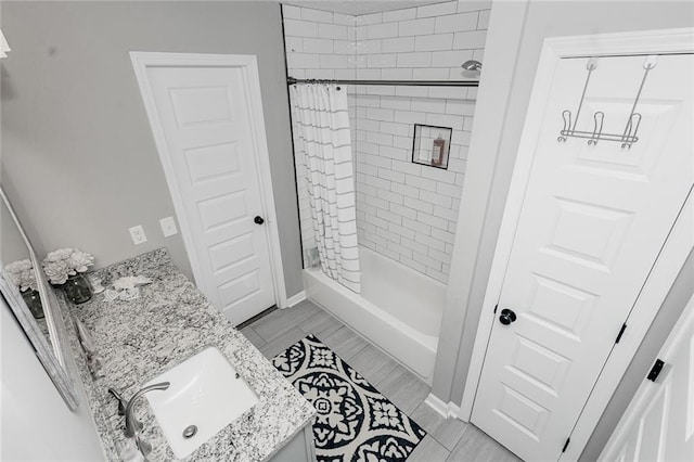 bathroom featuring vanity and curtained shower