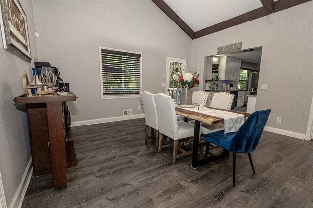 dining room with beamed ceiling, dark hardwood / wood-style flooring, and high vaulted ceiling