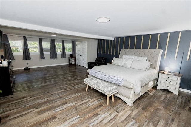 bedroom with dark hardwood / wood-style floors