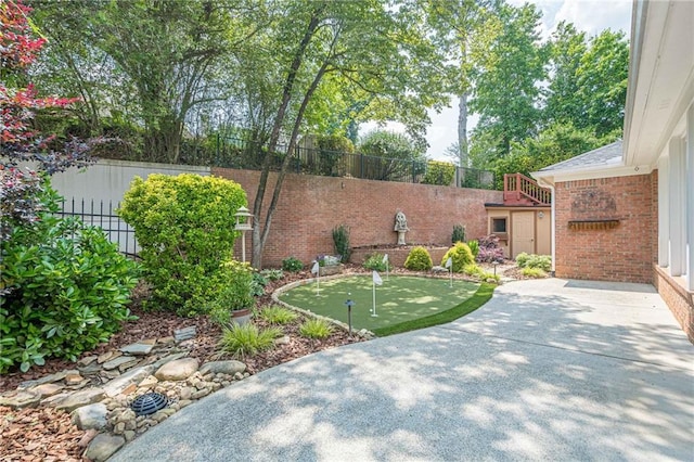 10280 Medridge Cir, Johns Creek, GA 30022 - view of yard featuring a putting green and a patio