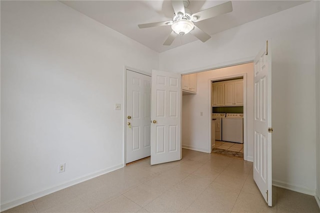 10280 Medridge Cir, Johns Creek, GA 30022 - unfurnished bedroom with washer and clothes dryer, baseboards, and a ceiling fan