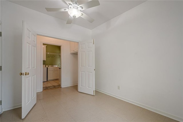 10280 Medridge Cir, Johns Creek, GA 30022 - unfurnished bedroom with baseboards, ceiling fan, a sink, and washer and clothes dryer