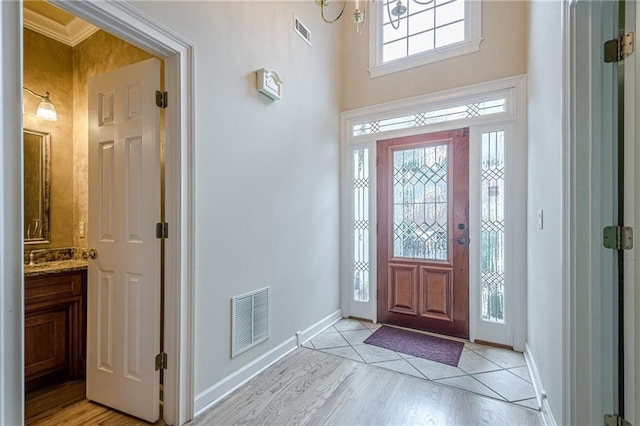 10280 Medridge Cir, Johns Creek, GA 30022 - foyer entrance featuring baseboards, light wood-style floors, and ornamental molding