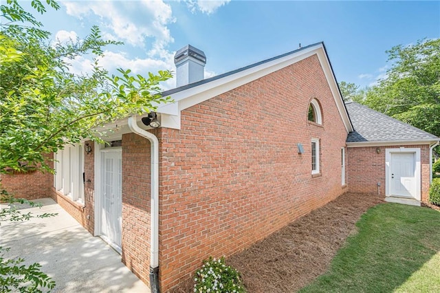 10280 Medridge Cir, Johns Creek, GA 30022 - view of side of property with a chimney, a shingled roof, and brick siding