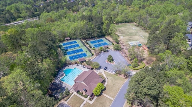10280 Medridge Cir, Johns Creek, GA 30022 - aerial view of property and surrounding area featuring a pool and a heavily wooded area