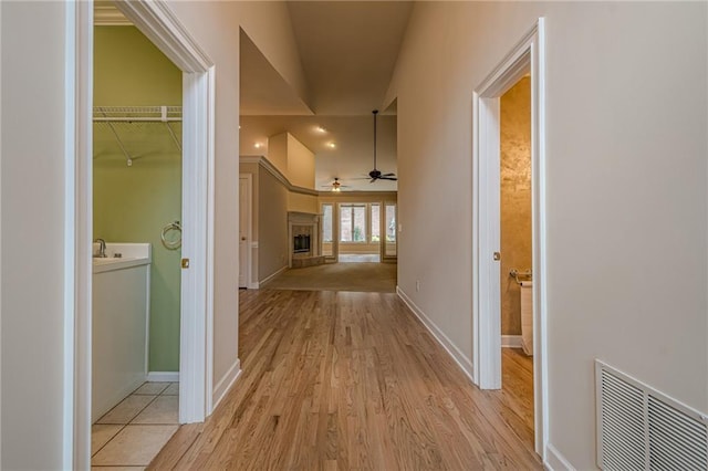 10280 Medridge Cir, Johns Creek, GA 30022 - hallway with light wood-style floors and baseboards
