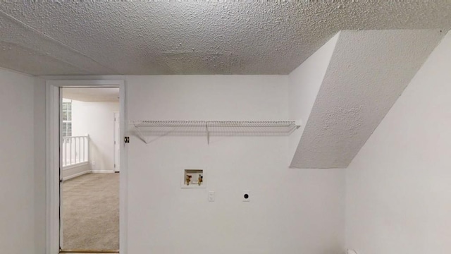 clothes washing area featuring washer hookup, hookup for an electric dryer, a textured ceiling, carpet floors, and baseboards