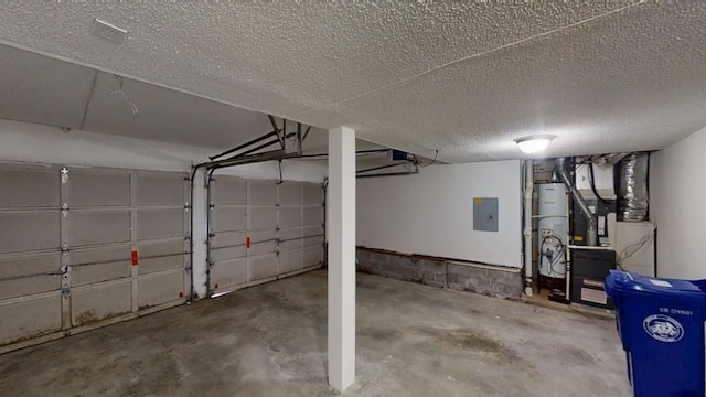 garage featuring electric panel, gas water heater, and a garage door opener