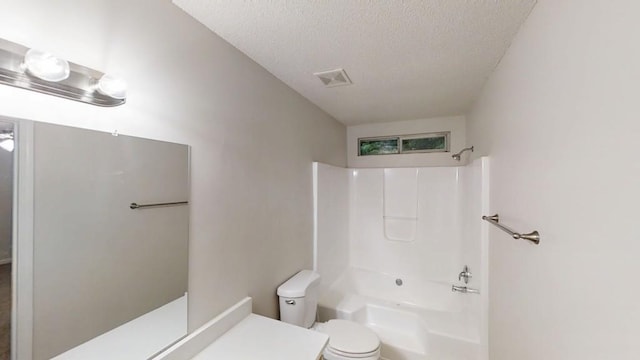 bathroom featuring a textured ceiling, toilet, and shower / bathtub combination