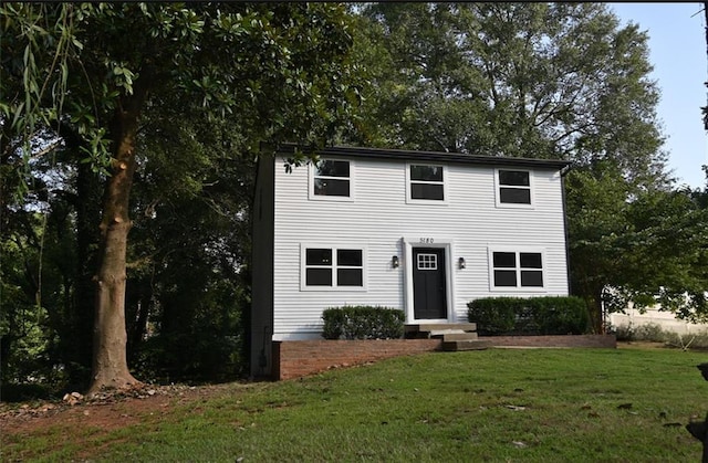 colonial home with a front yard