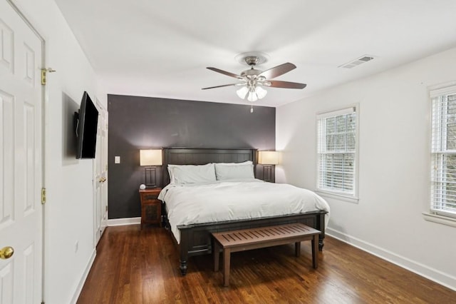 bedroom featuring dark hardwood / wood-style floors and ceiling fan