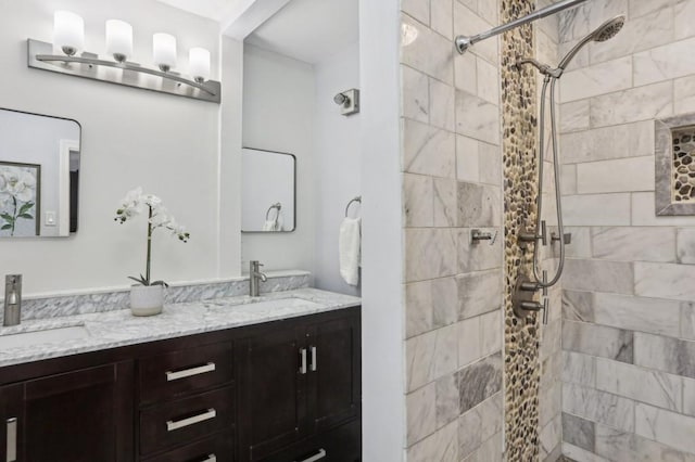 bathroom featuring vanity and a tile shower