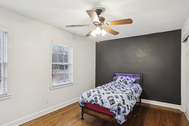 bedroom featuring hardwood / wood-style floors and ceiling fan