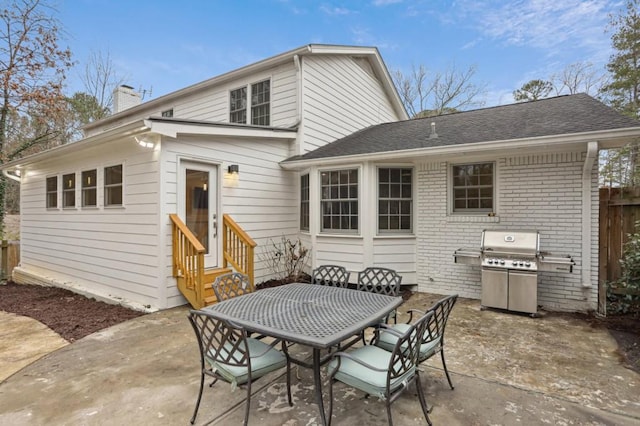 rear view of property featuring a patio area