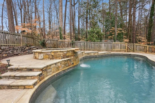 view of pool with pool water feature