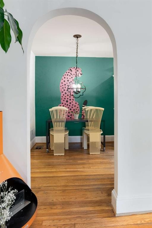 dining room with hardwood / wood-style flooring