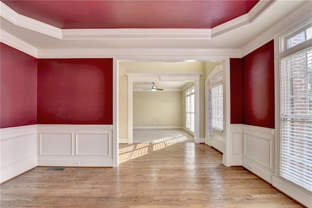 1755 Riverpark Dr, Dacula, GA 30019 - foyer featuring ornamental molding, plenty of natural light, a ceiling fan, wood finished floors, and wainscoting