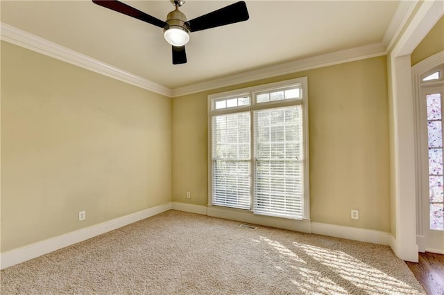 1755 Riverpark Dr, Dacula, GA 30019 - spare room featuring ornamental molding, healthy amount of natural light, ceiling fan, and carpet floors