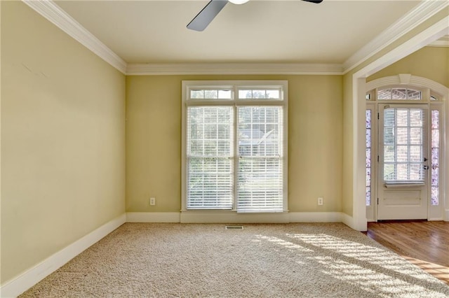 1755 Riverpark Dr, Dacula, GA 30019 - carpeted empty room featuring ornamental molding, a ceiling fan, and plenty of natural light
