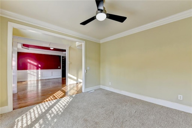 1755 Riverpark Dr, Dacula, GA 30019 - spare room featuring carpet floors, crown molding, and ceiling fan