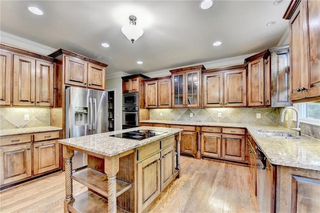 1755 Riverpark Dr, Dacula, GA 30019 - kitchen with stainless steel appliances, crown molding, light wood-type flooring, decorative backsplash, and light stone counters