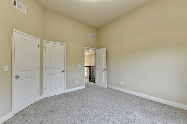 1755 Riverpark Dr, Dacula, GA 30019 - unfurnished bedroom featuring carpet floors and high vaulted ceiling