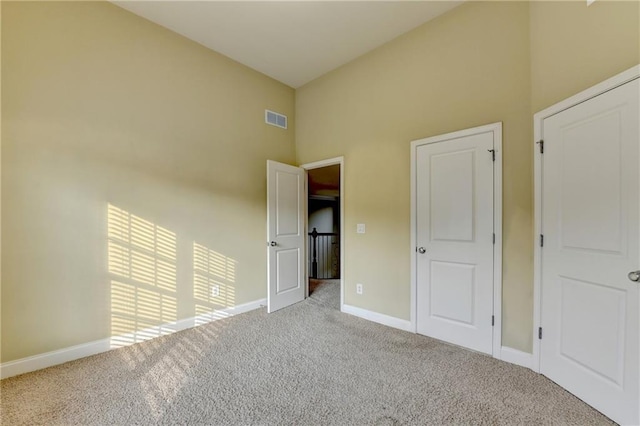 1755 Riverpark Dr, Dacula, GA 30019 - unfurnished bedroom with high vaulted ceiling and carpet floors