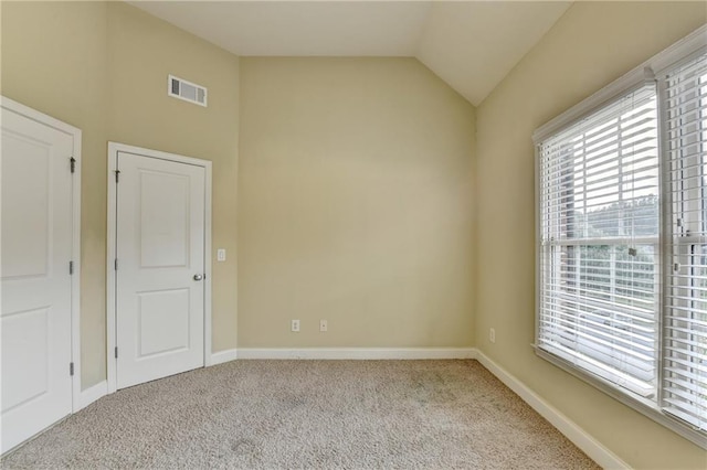 1755 Riverpark Dr, Dacula, GA 30019 - unfurnished room featuring plenty of natural light, carpet floors, and lofted ceiling