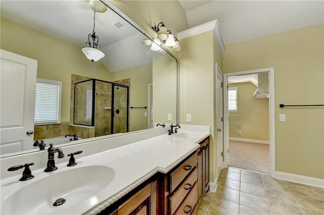 1755 Riverpark Dr, Dacula, GA 30019 - bathroom featuring a stall shower, vaulted ceiling, double vanity, and a garden tub