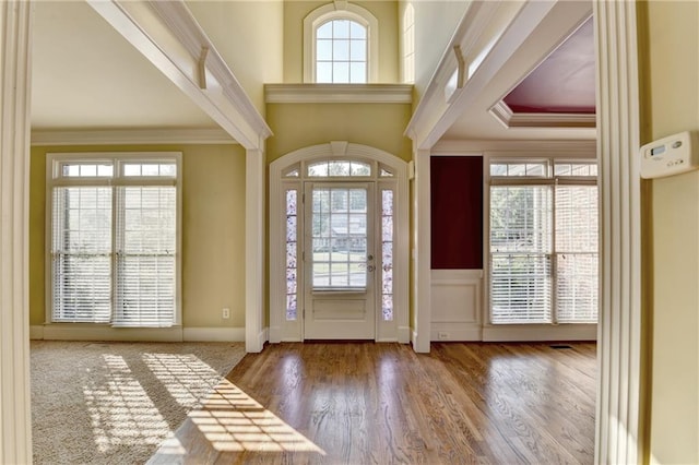 1755 Riverpark Dr, Dacula, GA 30019 - entryway with ornamental molding, wood finished floors, and a wainscoted wall
