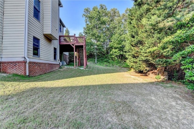 1755 Riverpark Dr, Dacula, GA 30019 - view of green lawn with stairs and a wooden deck